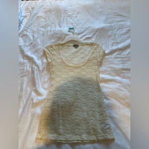 Guess lace flowers shirt size medium.